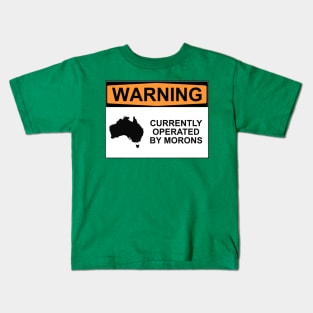 WARNING: CURRENTLY OPERATED BY MORONS Kids T-Shirt